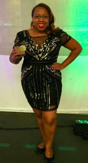 A reviewer wearing the black short sleeve dress with silver beading