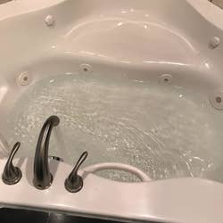 Same reviewer's jetted tub with clean water and a sparkly exterior