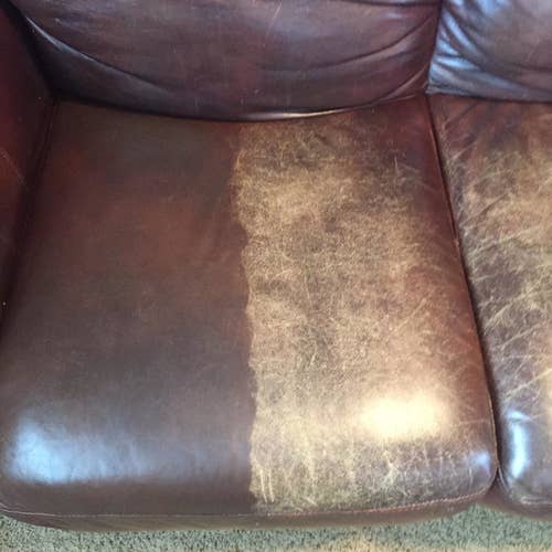 Couch cushion where half of the cushion has been recolored and you can clearly see how much better it looks in comparison to the faded brown leather