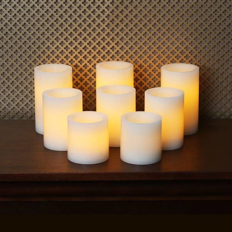 three large, three medium, and two small white flameless candles