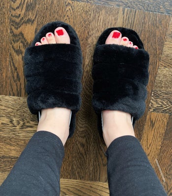 BuzzFeed editor Maitland Quitmeyer wearing the fuzzy slippers, showing the open toe