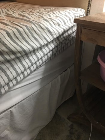 Reviewer photo of their fitted sheet, which has ridden up off the mattress