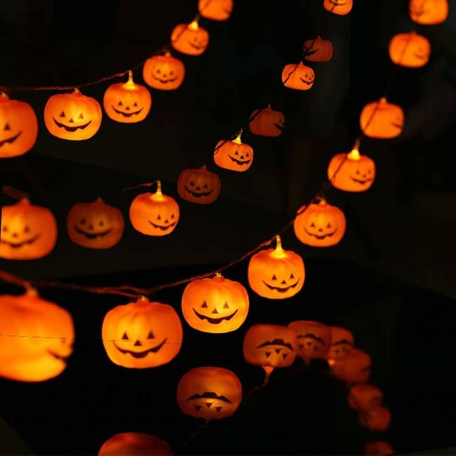 the pumpkin string lights glowing in the dark