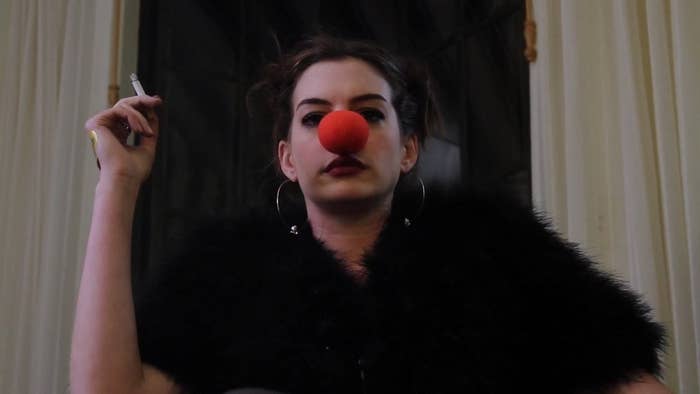 Anne Hathaway wears a clown nose