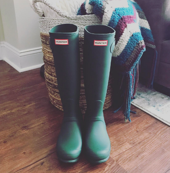 reviewer photo of the boots in green