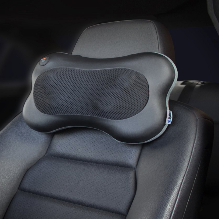 The massage pillow attached the seat of a car