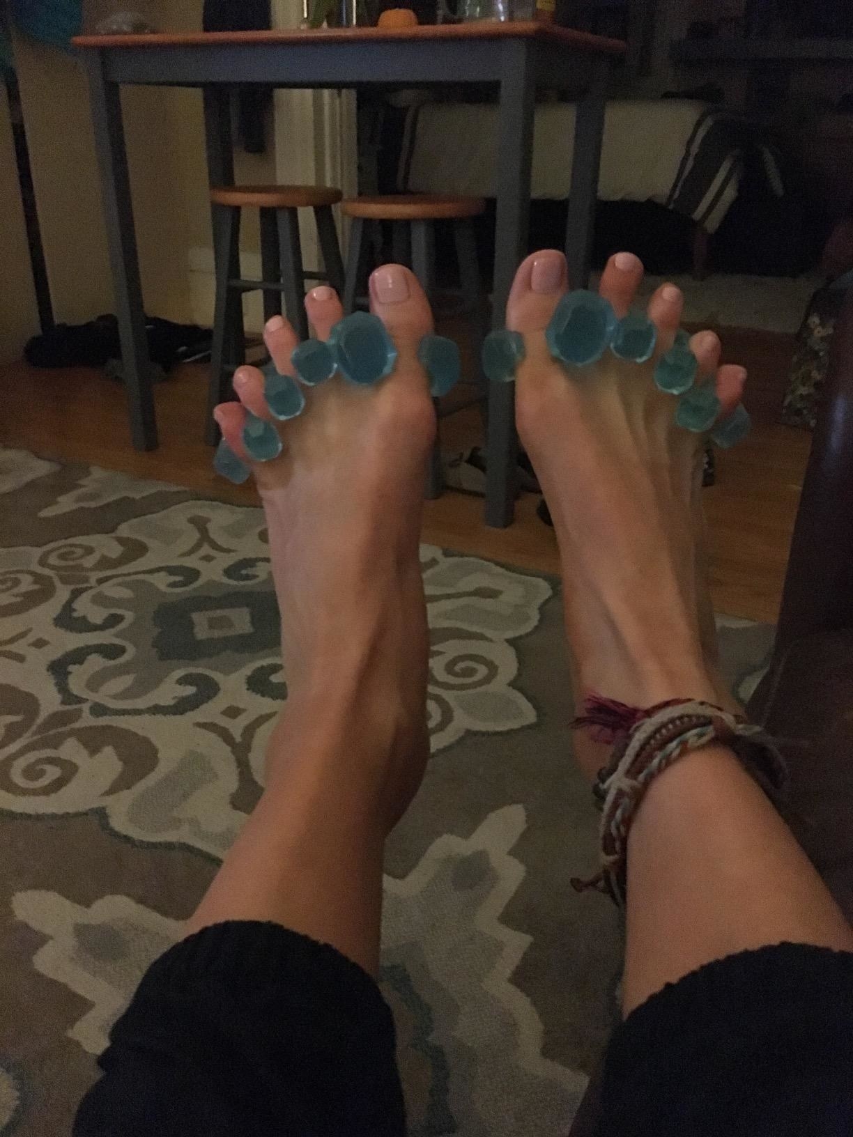 Reviewer using the toe stretchers on both feet