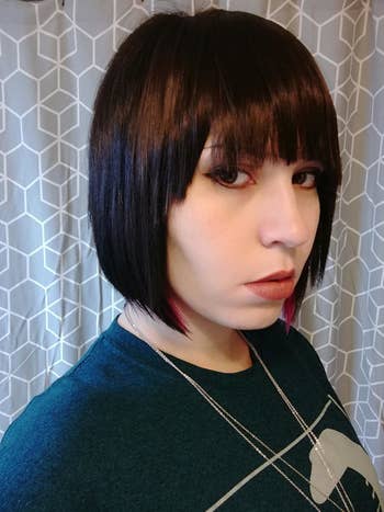 reviewer with the clip-in bangs attached, looking realistic as if they've cut their own bangs