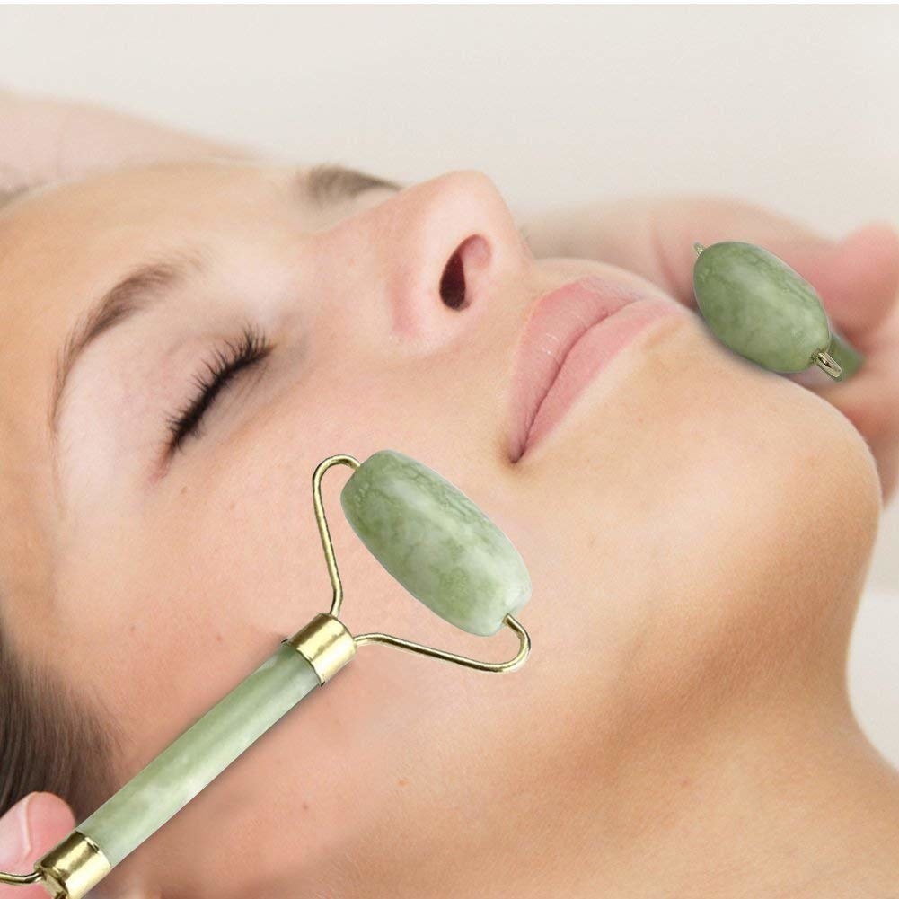 A woman using the jade roller.
