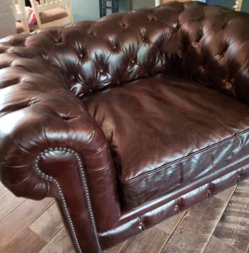 reviewer after image of a rejuvenated and bright brown leather armchair