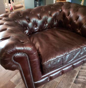 reviewer after image of a rejuvenated and bright brown leather armchair