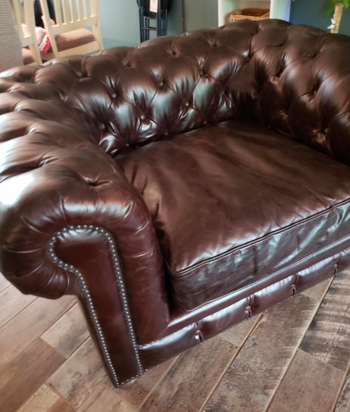 Reviewer after image of a rejuvenated and bright brown leather armchair