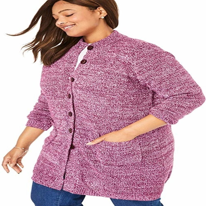 A model wearing the pink sweater