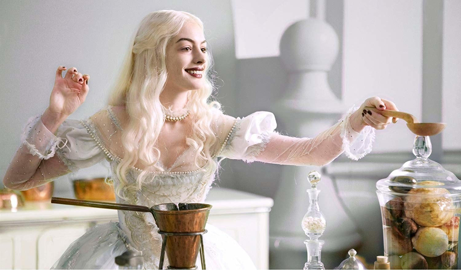 Anne Hathaway holds out a spoon
