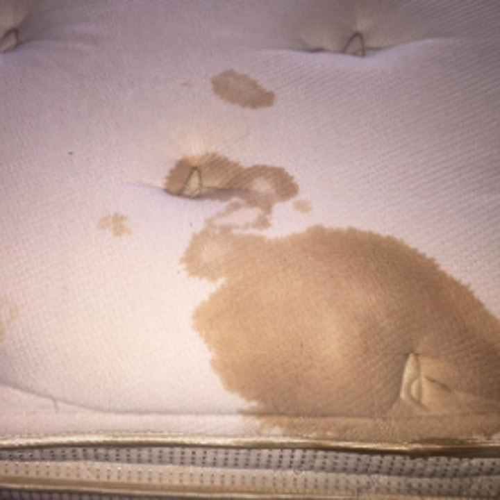 a reviewer's stained mattress