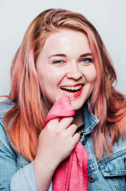 buzzfeed writer showing how half of their lipstick is perfectly removed by the eraser cloth