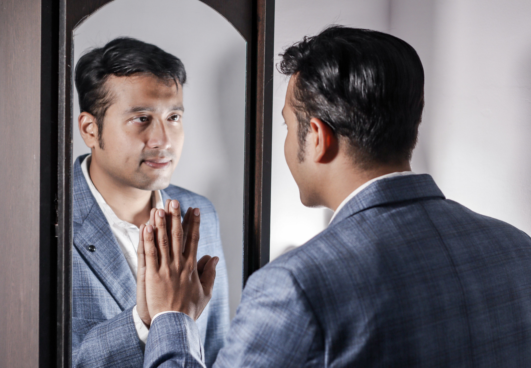 Man in Front of Mirror