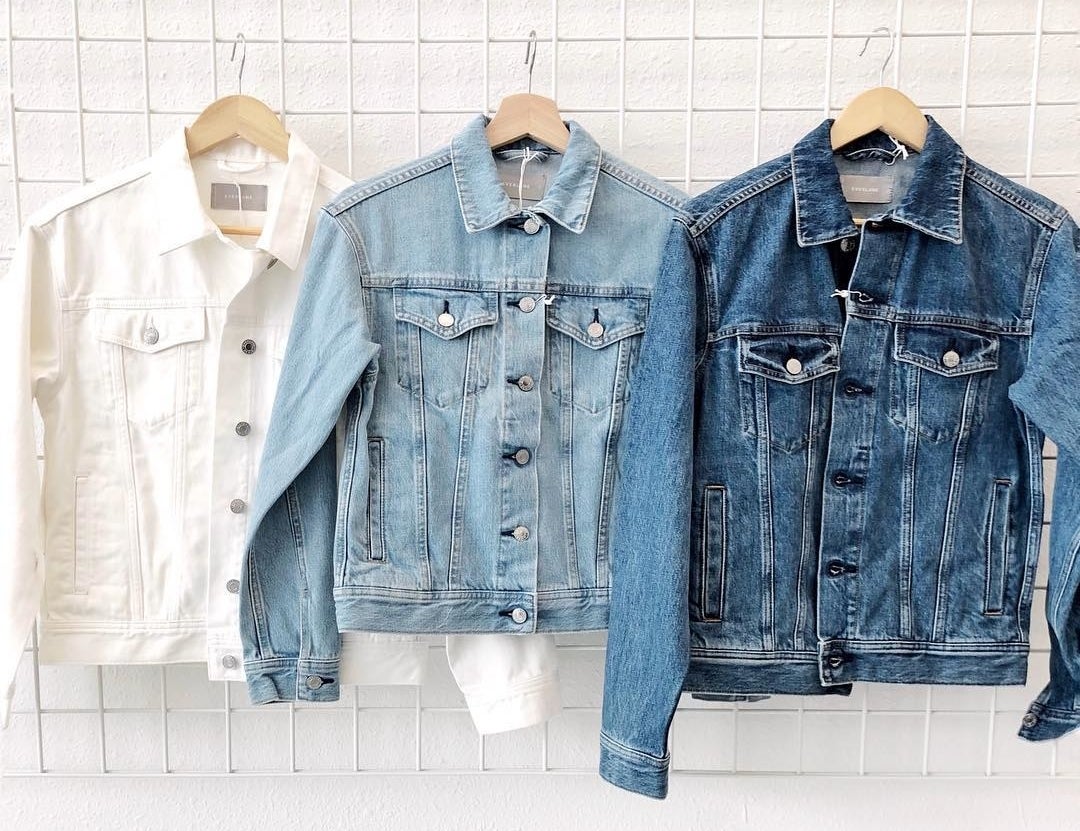 white, light blue, and dark blue denim jackets