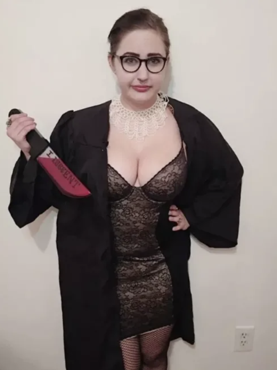 A woman dressed as a sexy Ruth Bader Ginsburg with a bloody knife