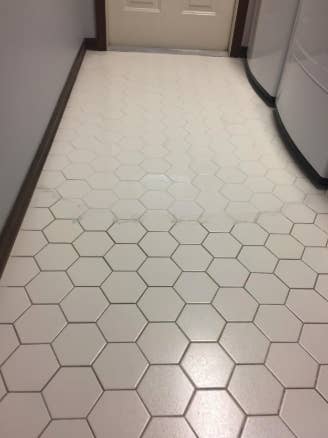 a reviewer's grout half cleaned using the brushes