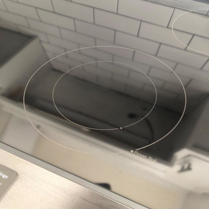 the same stovetop without any stains, looking very clean and shiny 