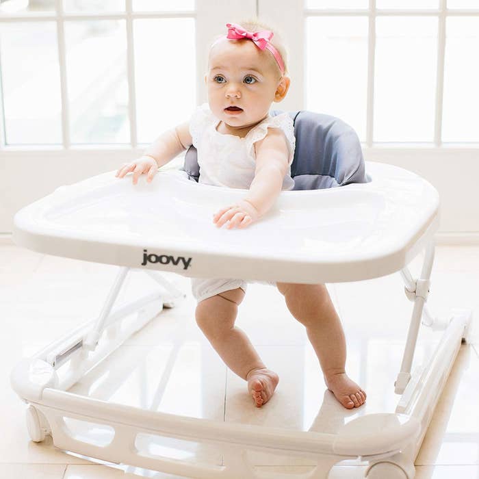 a baby in the joovy walker