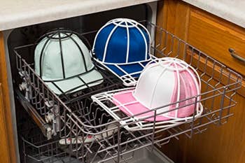 several caps in the formed cages sitting in a dishwasher 