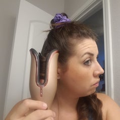 Same reviewer with their hair inside the curler