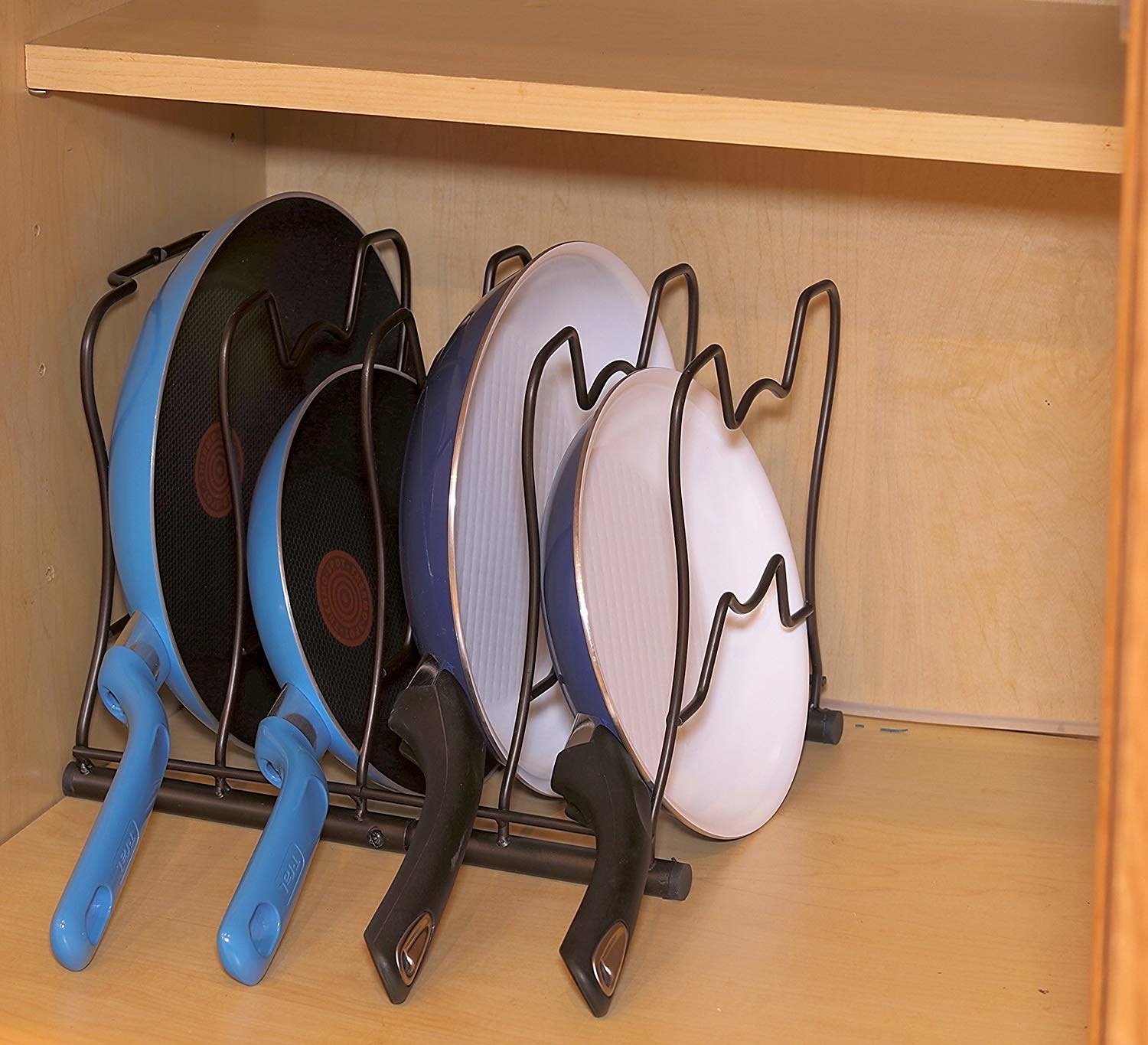 four pans standing in a rack