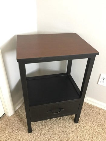 Reviewer's small table with brown surface 