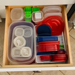The drawer with the organizer in it, keeping the lids much more organized