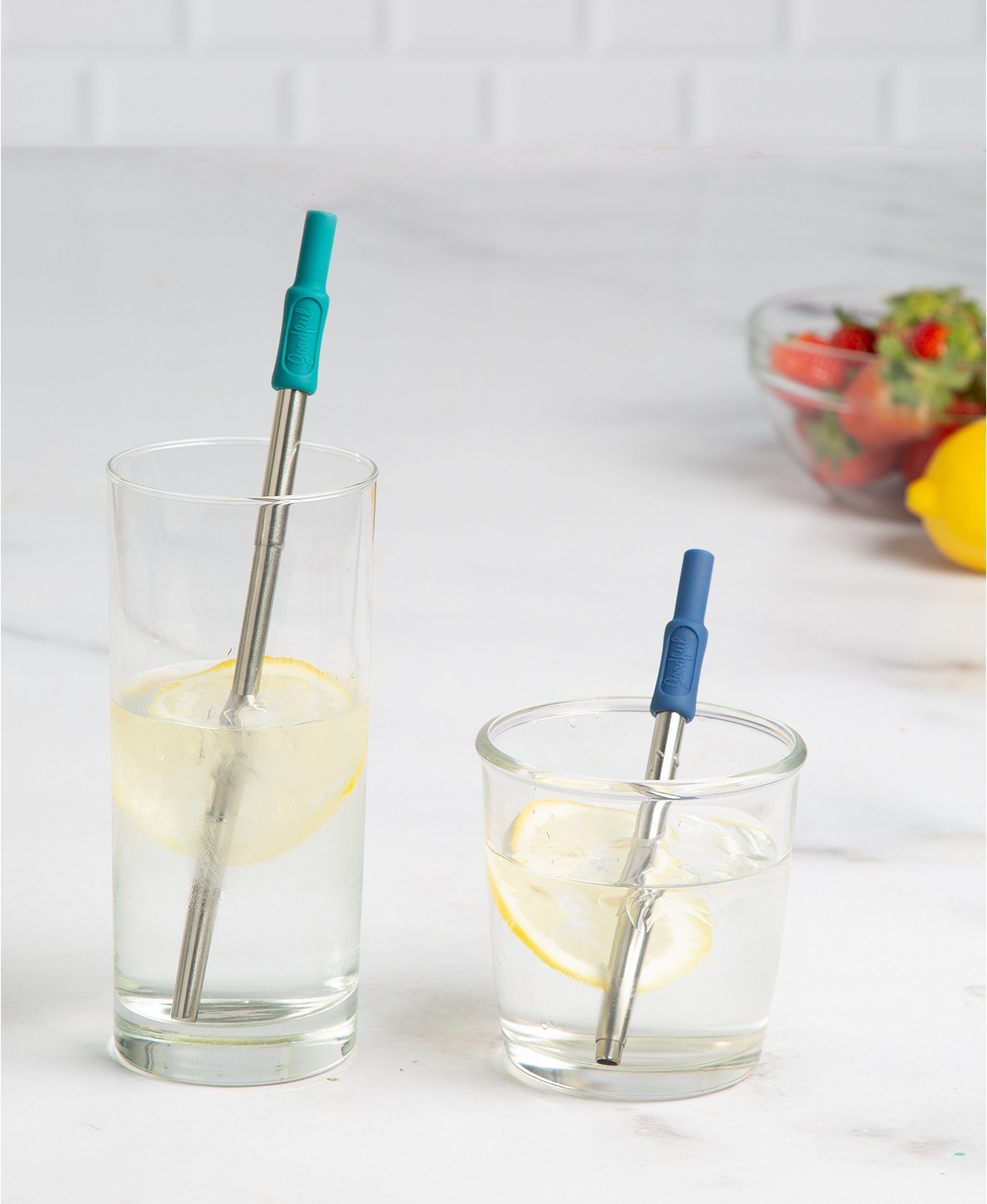 Two different size straws in two glasses with the silicone tips