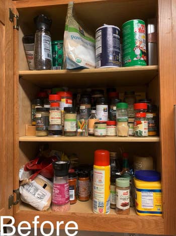 three-shelf cabinet space with spices in no particular order 