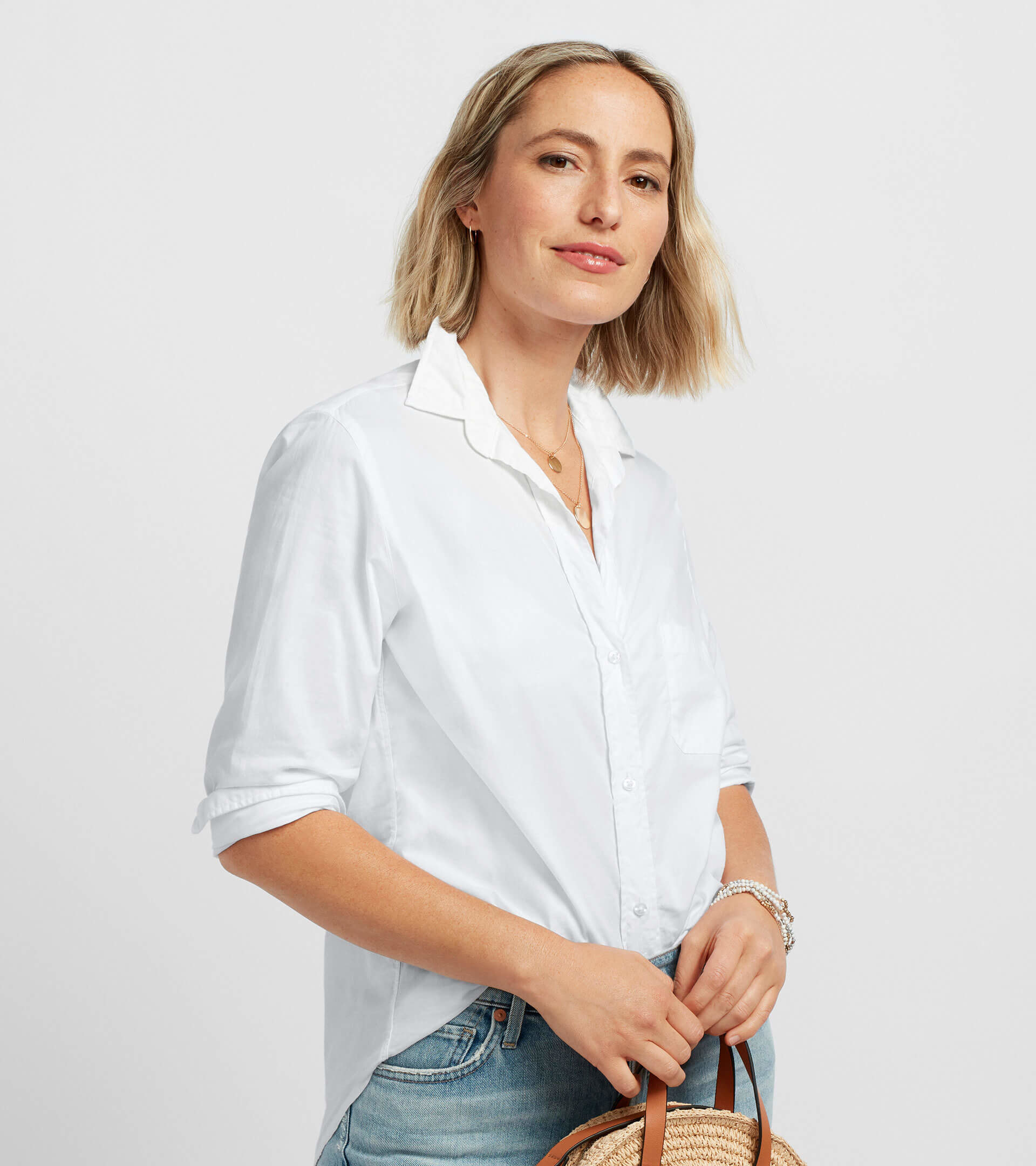 Model wearing the white button-down shirt