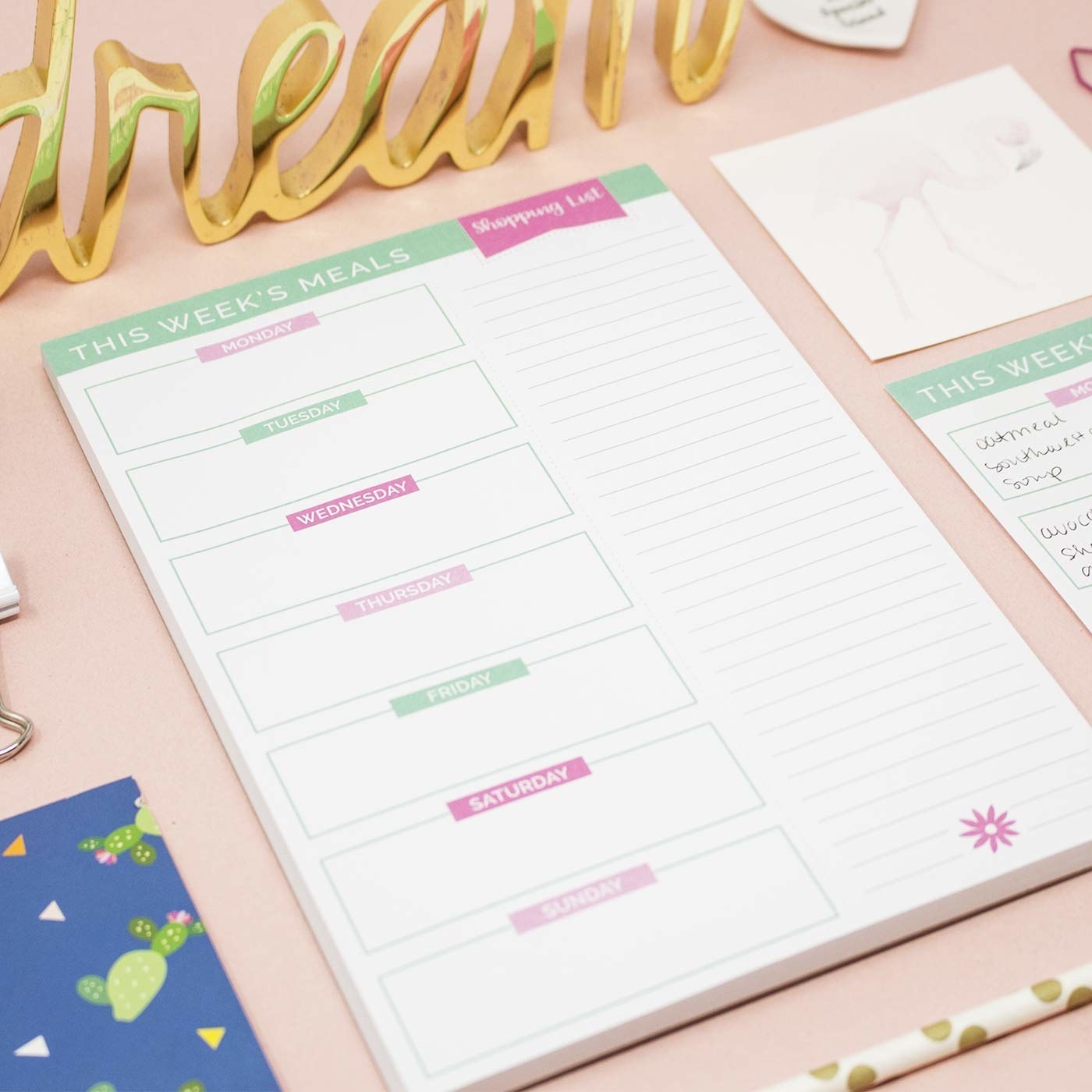 The meal prep planner on a desk
