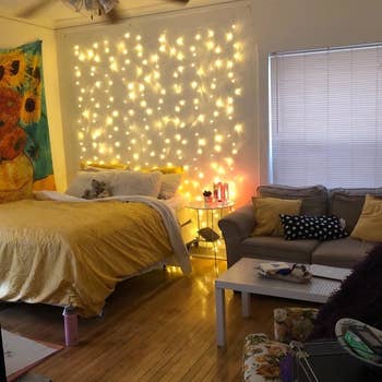 reviewer's twinkle lights above their bed 