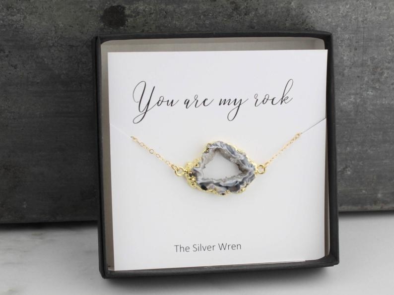 Open geode with gold chain