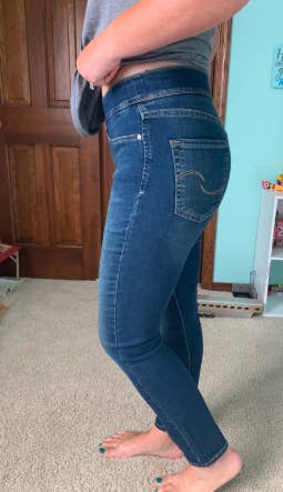 another reviewer wearing the jeans in medium blue