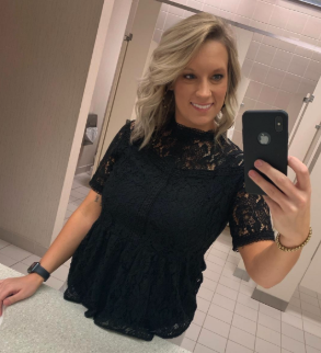 a reviewer in the high neck lace peplum top in black