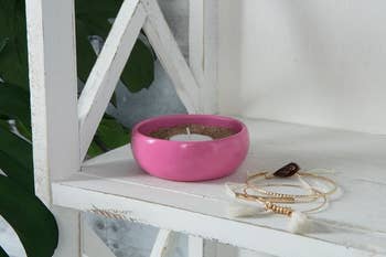 the pink dish on a shelf 
