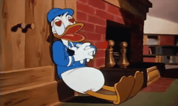 Donald Duck with his hands over his heart beating fast with animated hearts coming out of it