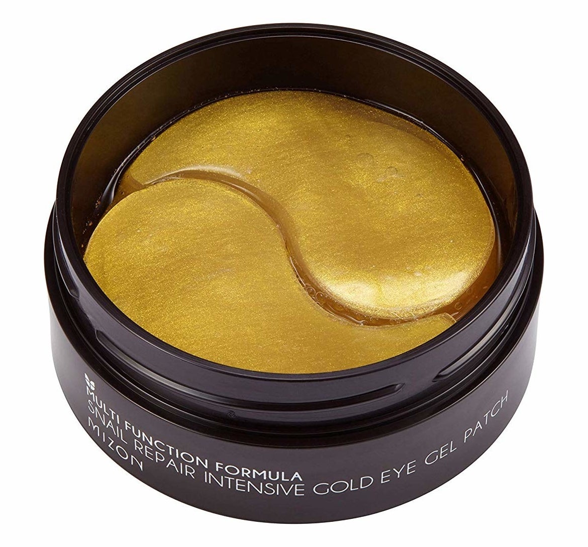 A jar of the eye masks in gold
