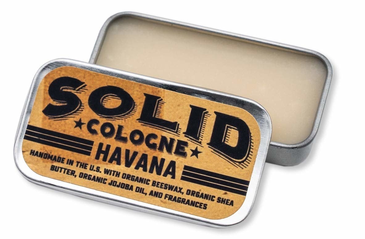 A small rectangular tin with the solid cologne inside