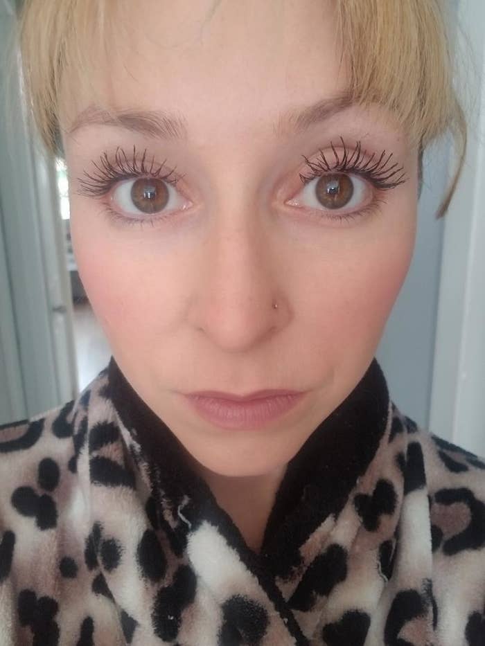 reviewer showing their long eyelashes 