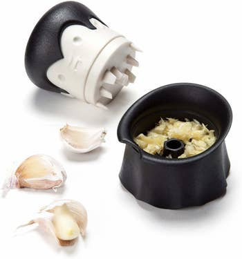 the dracula garlic chopper open to show the garlic inside