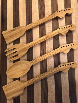 a reviewer's photo of the four wooden tools with guitar handles