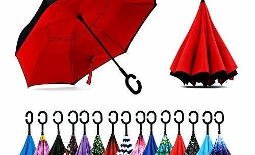 The umbrella with a black outside and red inside open and then closed next to it, showing how it closes in on itself