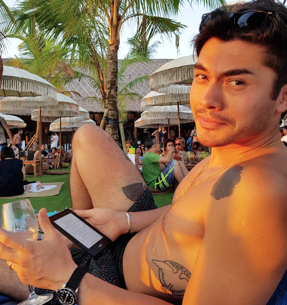 If Henry Golding reading while holding a glass of wine and wearing nothing ...