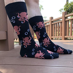a pair of socks with an octopus design