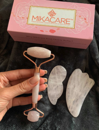 a reviewer holding the rose quartz roller